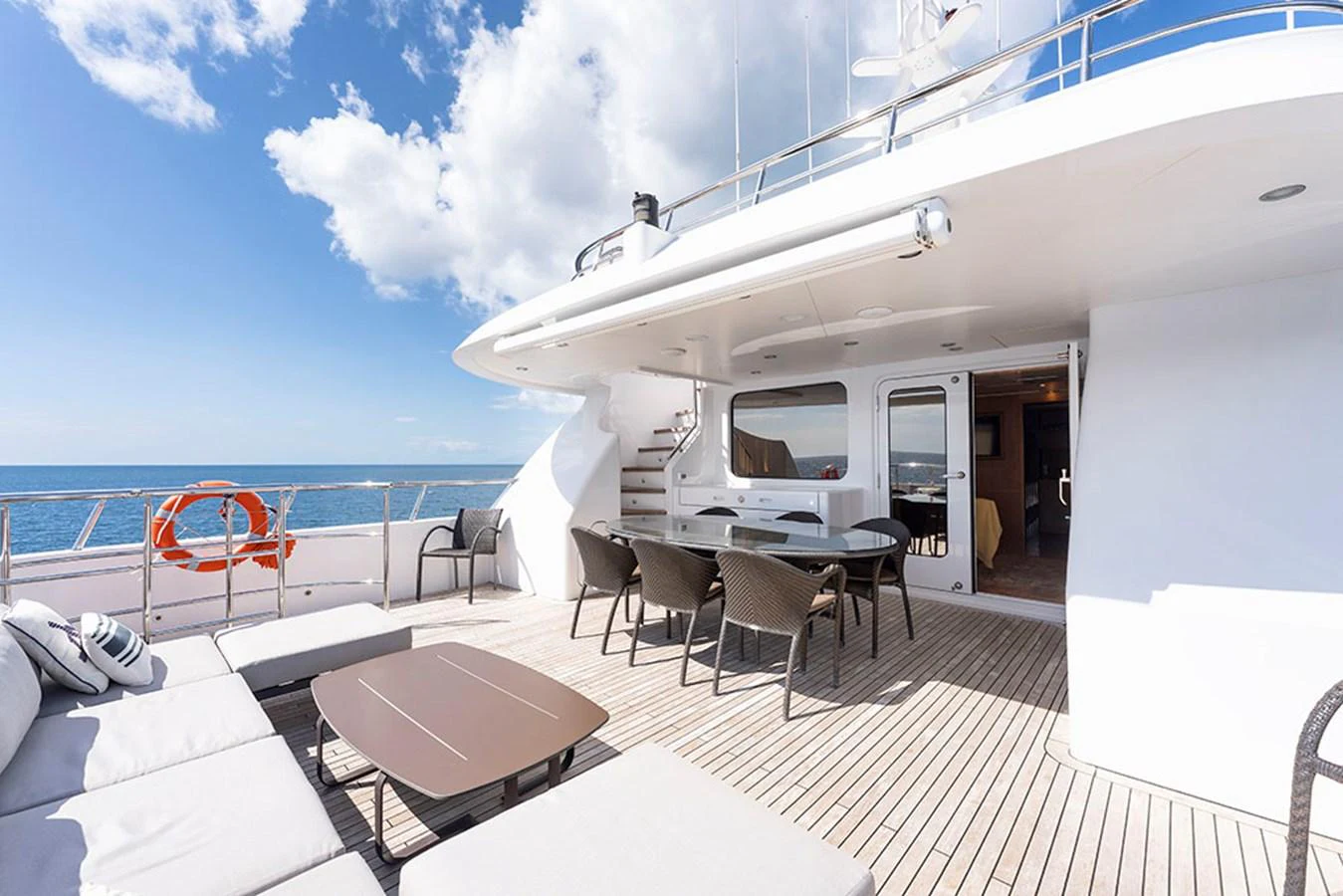 The aft deck offers a spacious and inviting area for outdoor relaxation and dining with stunning ocean views. aboard BANDIDO Yacht for Sale