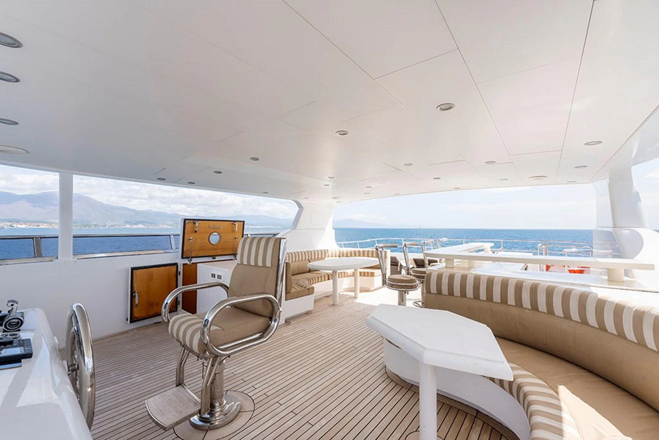 The flybridge offers a spacious and comfortable seating area with panoramic ocean views. aboard BANDIDO Yacht for Sale