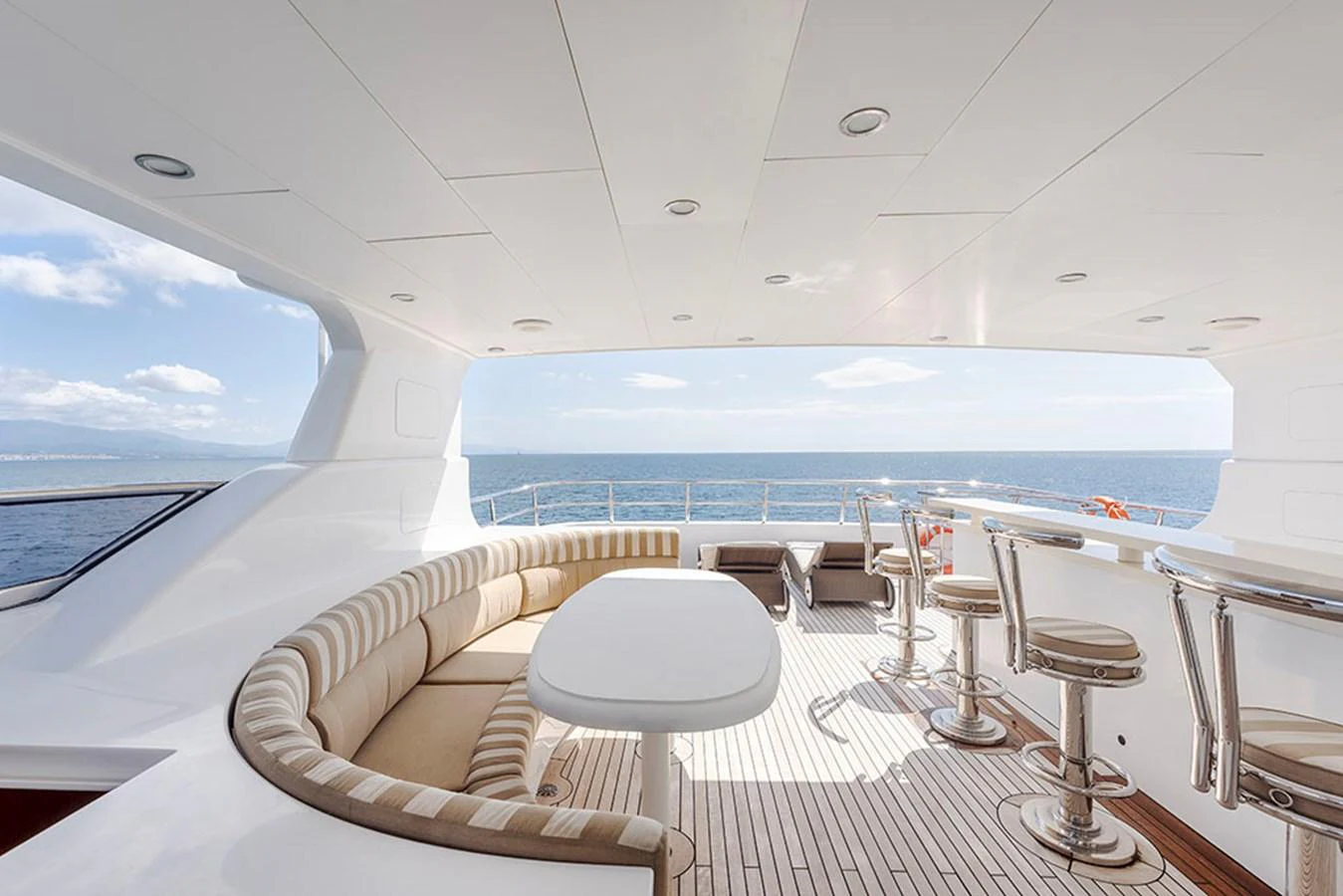 The aft deck offers a spacious and stylish area for relaxation and dining with stunning ocean views. aboard BANDIDO Yacht for Sale