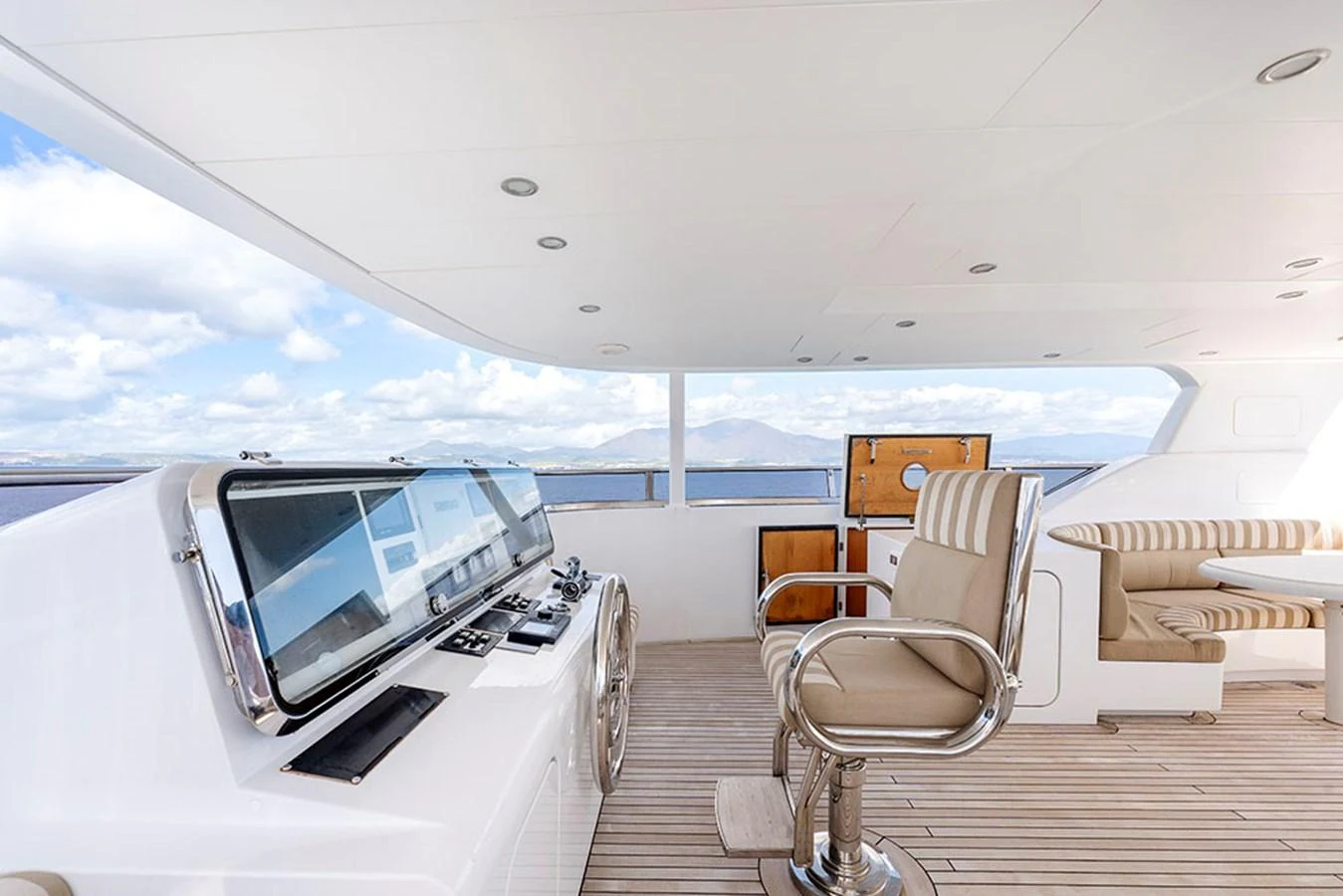 The flybridge offers a spacious and comfortable area with seating and navigation equipment, perfect for enjoying panoramic views. aboard BANDIDO Yacht for Sale