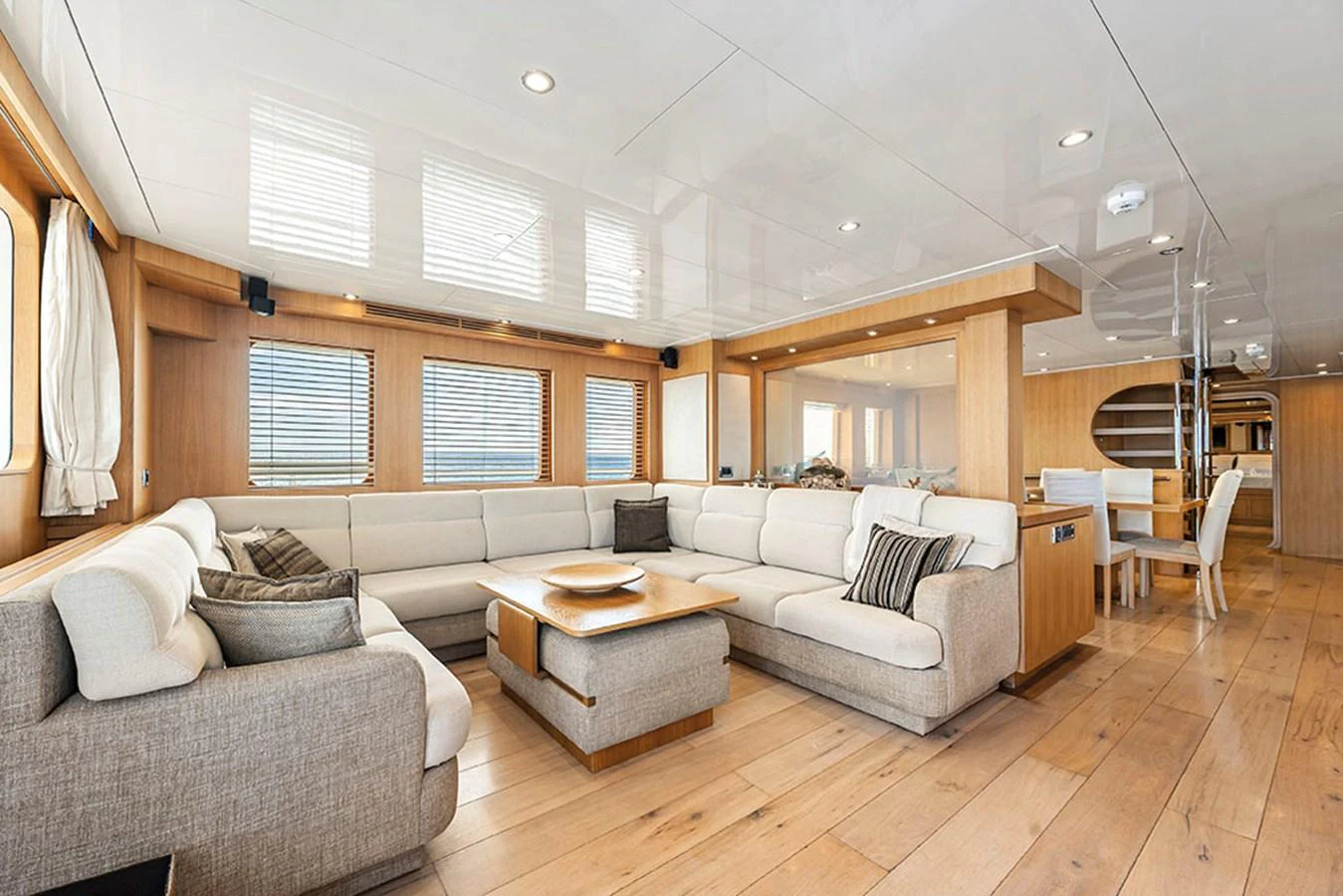 The spacious salon features a large, comfortable seating area with modern decor and ample natural light. aboard BANDIDO Yacht for Sale