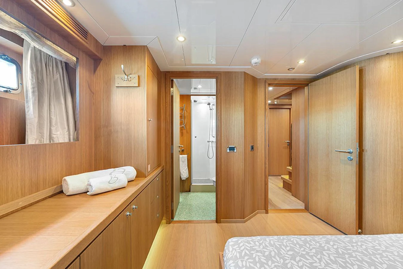 The yacht's stateroom features elegant wood paneling and a cozy, inviting atmosphere. aboard BANDIDO Yacht for Sale