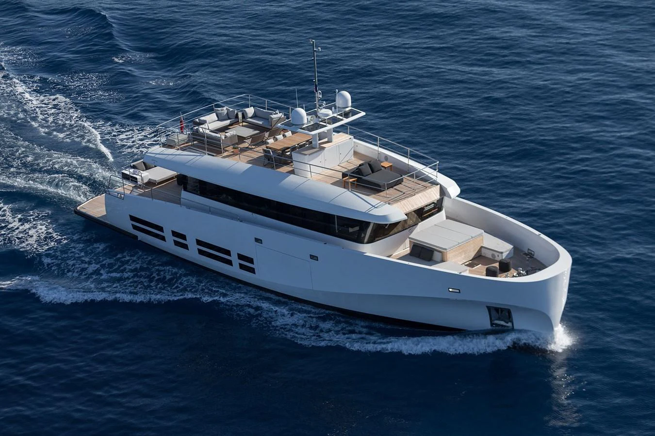 A sleek and modern yacht cruises gracefully on the open sea. aboard CASA Yacht for Sale