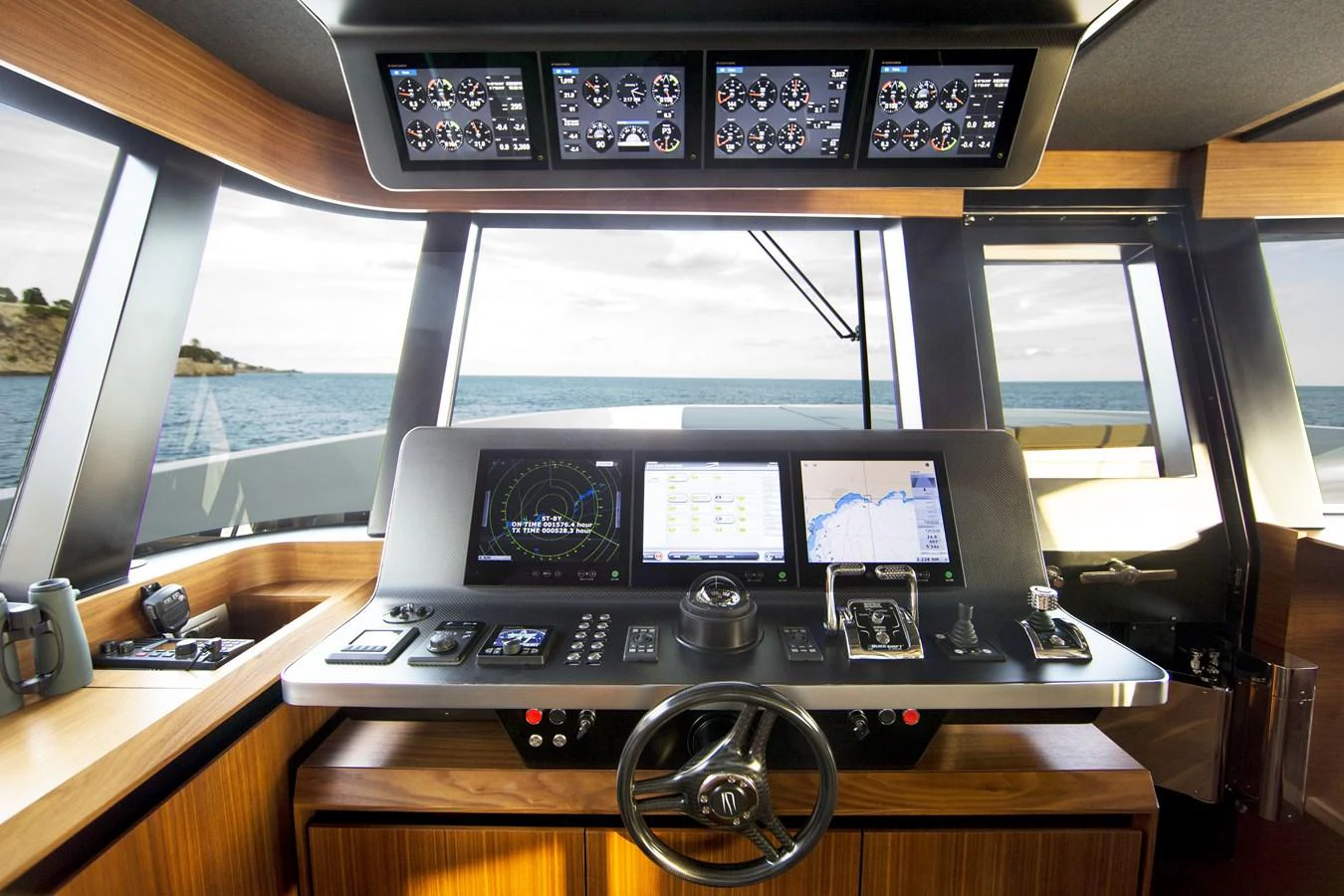 The helm station offers a sophisticated and modern control center with advanced navigation equipment and panoramic views. aboard CASA Yacht for Sale