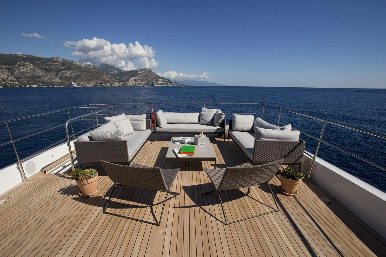 The aft deck offers a spacious and comfortable seating area with stunning ocean views. aboard CASA Yacht for Sale