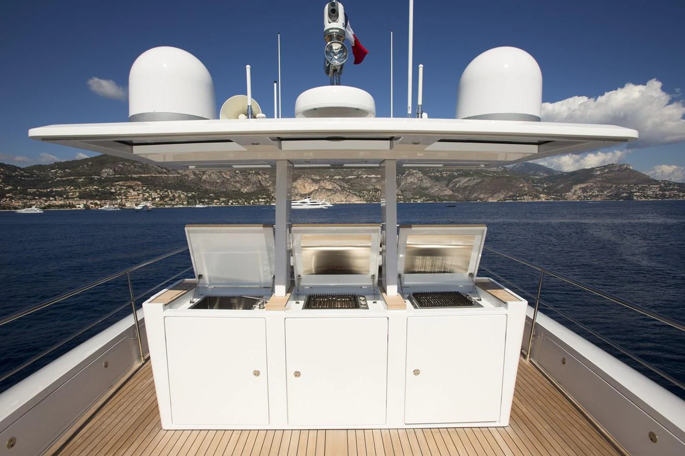 The yacht features a sleek outdoor kitchen with modern appliances, perfect for alfresco dining. aboard CASA Yacht for Sale