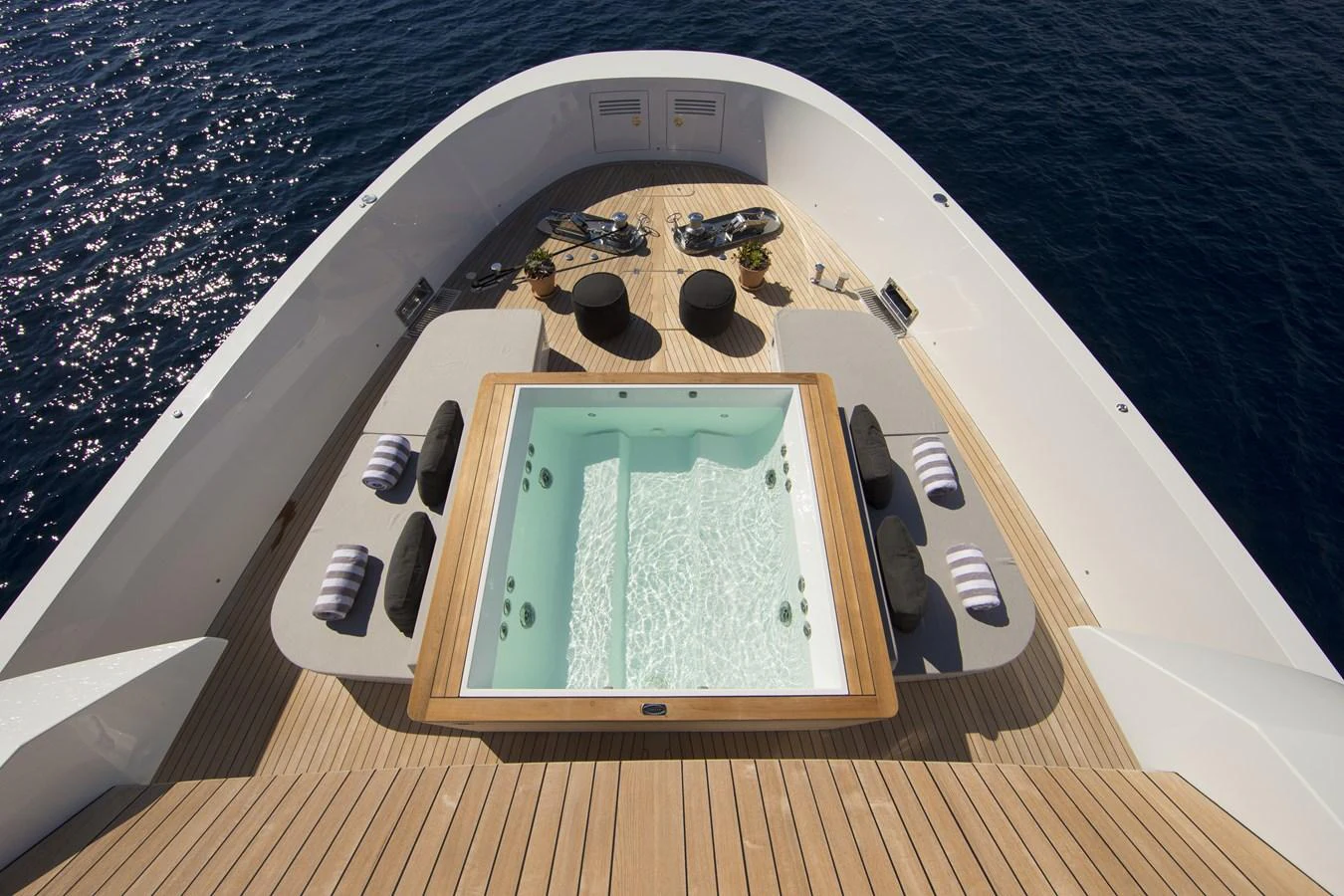The foredeck features a luxurious jacuzzi surrounded by comfortable seating, perfect for relaxation. aboard CASA Yacht for Sale