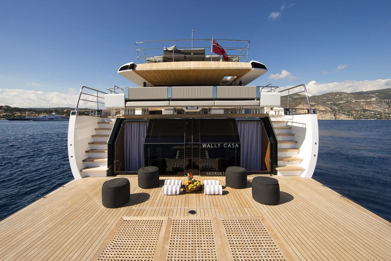 The spacious aft deck offers a luxurious outdoor lounging area with stunning views of the sea. aboard CASA Yacht for Sale