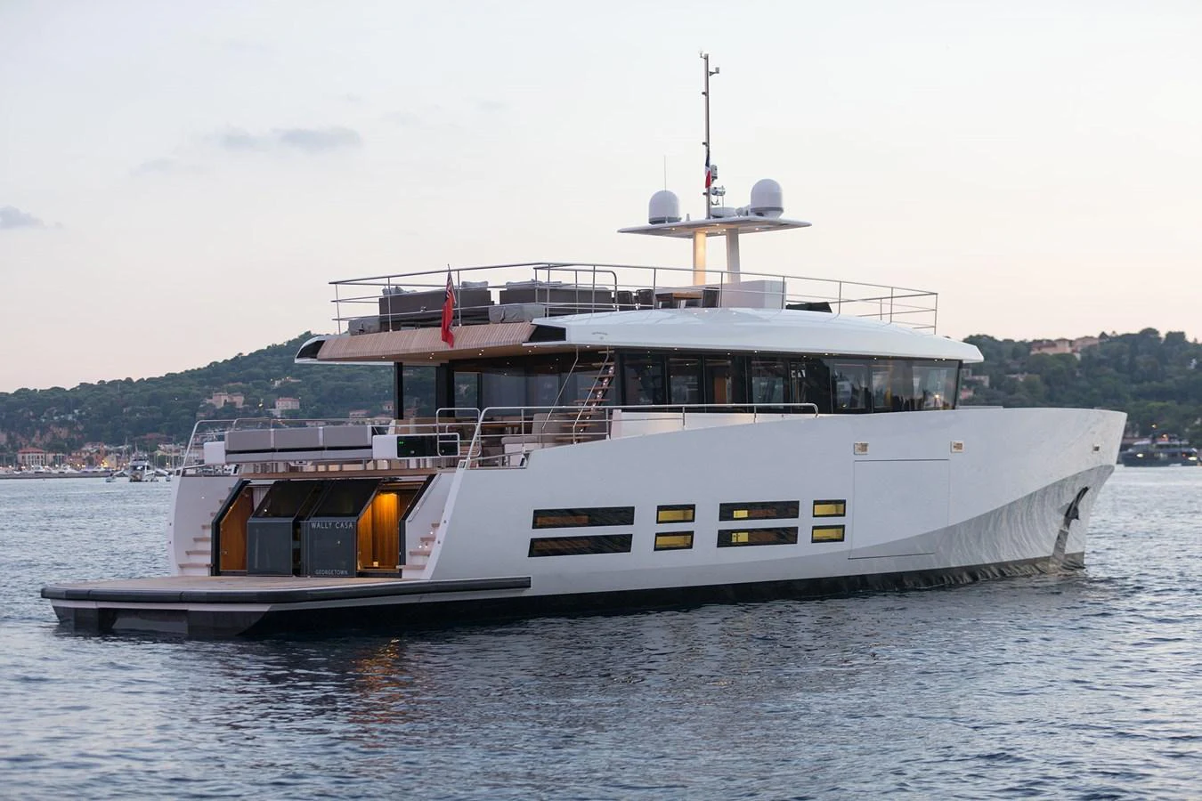 A sleek and modern yacht glides gracefully on calm waters, showcasing its contemporary design and spacious deck areas. aboard CASA Yacht for Sale
