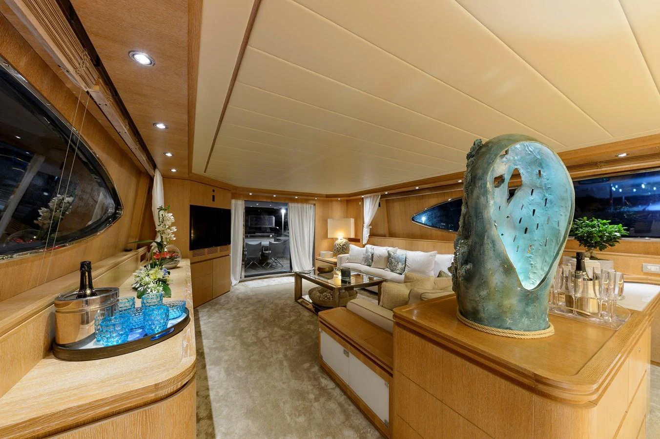 The yacht's interior features a spacious and elegantly designed living area with plush seating and tasteful decor. aboard AMAYA Yacht for Sale
