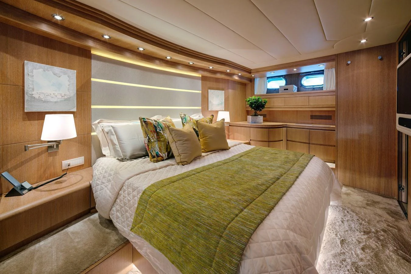 The master stateroom features a luxurious bed with elegant decor and ample natural light. aboard AMAYA Yacht for Sale