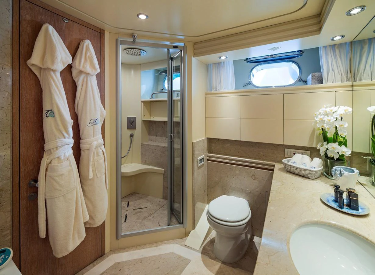 The yacht's bathroom features elegant fixtures and a spacious shower area. aboard AMAYA Yacht for Sale