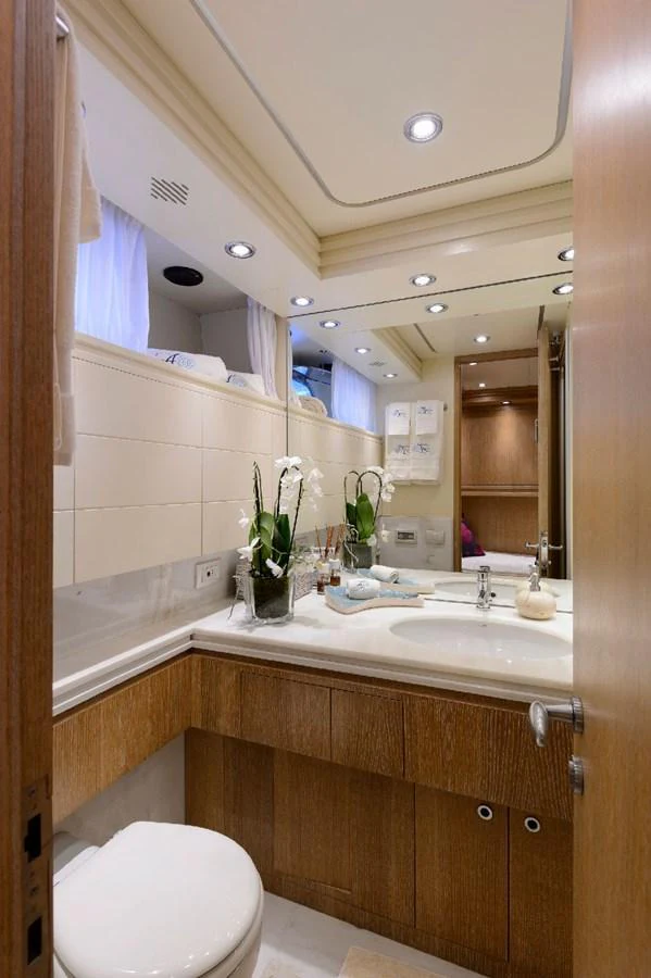 A well-appointed yacht bathroom featuring modern fixtures and elegant decor. aboard AMAYA Yacht for Sale
