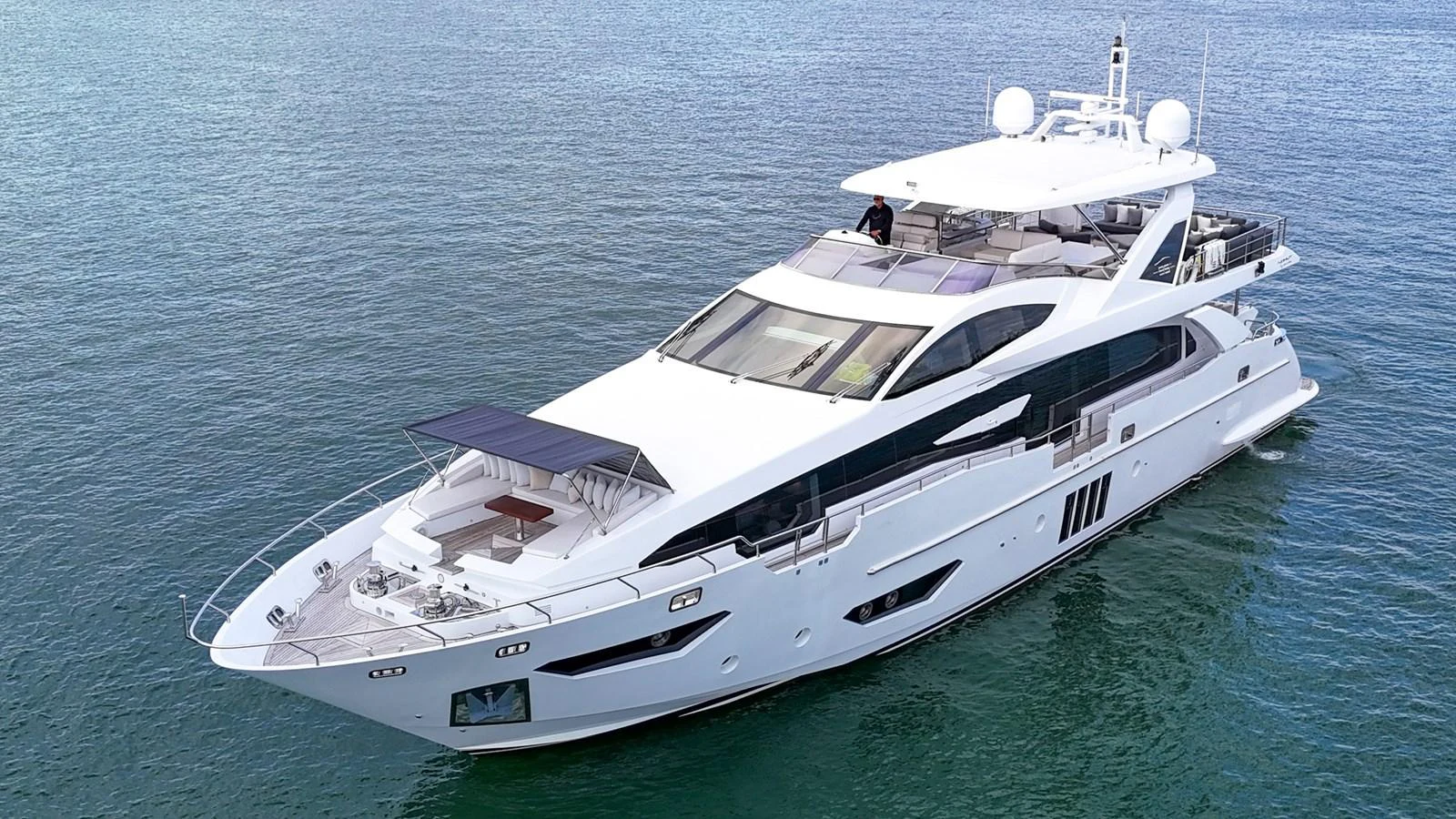 A sleek, modern yacht glides gracefully on calm waters, showcasing its elegant design and spacious decks. aboard 2017 AZIMUT 30 METRI Yacht for Sale