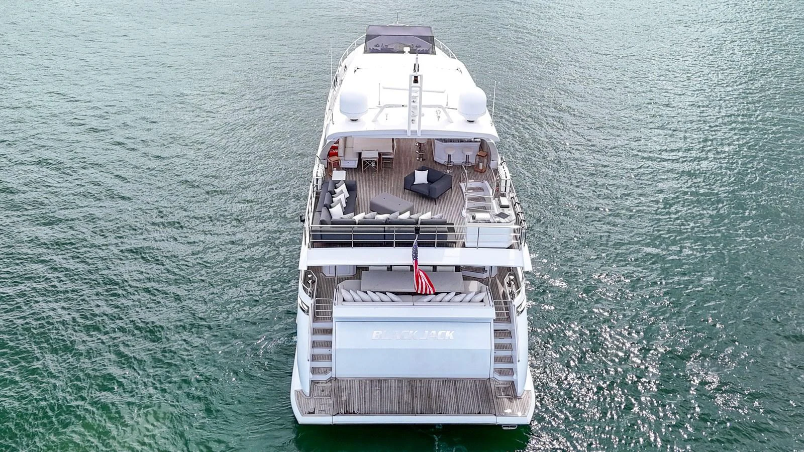 The yacht's aft deck offers a spacious and inviting area for relaxation and socializing on the water. aboard 2017 AZIMUT 30 METRI Yacht for Sale