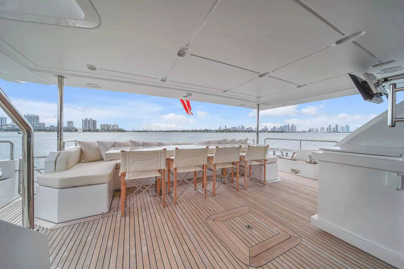 The aft deck offers a spacious and elegant outdoor dining area with stunning views. aboard 2017 AZIMUT 30 METRI Yacht for Sale