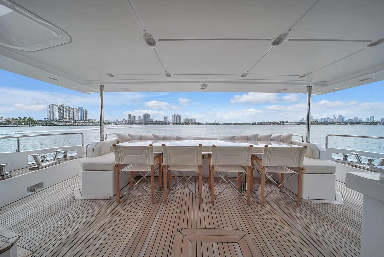 The aft deck offers a spacious and inviting area for alfresco dining with stunning views of the water and skyline. aboard 2017 AZIMUT 30 METRI Yacht for Sale