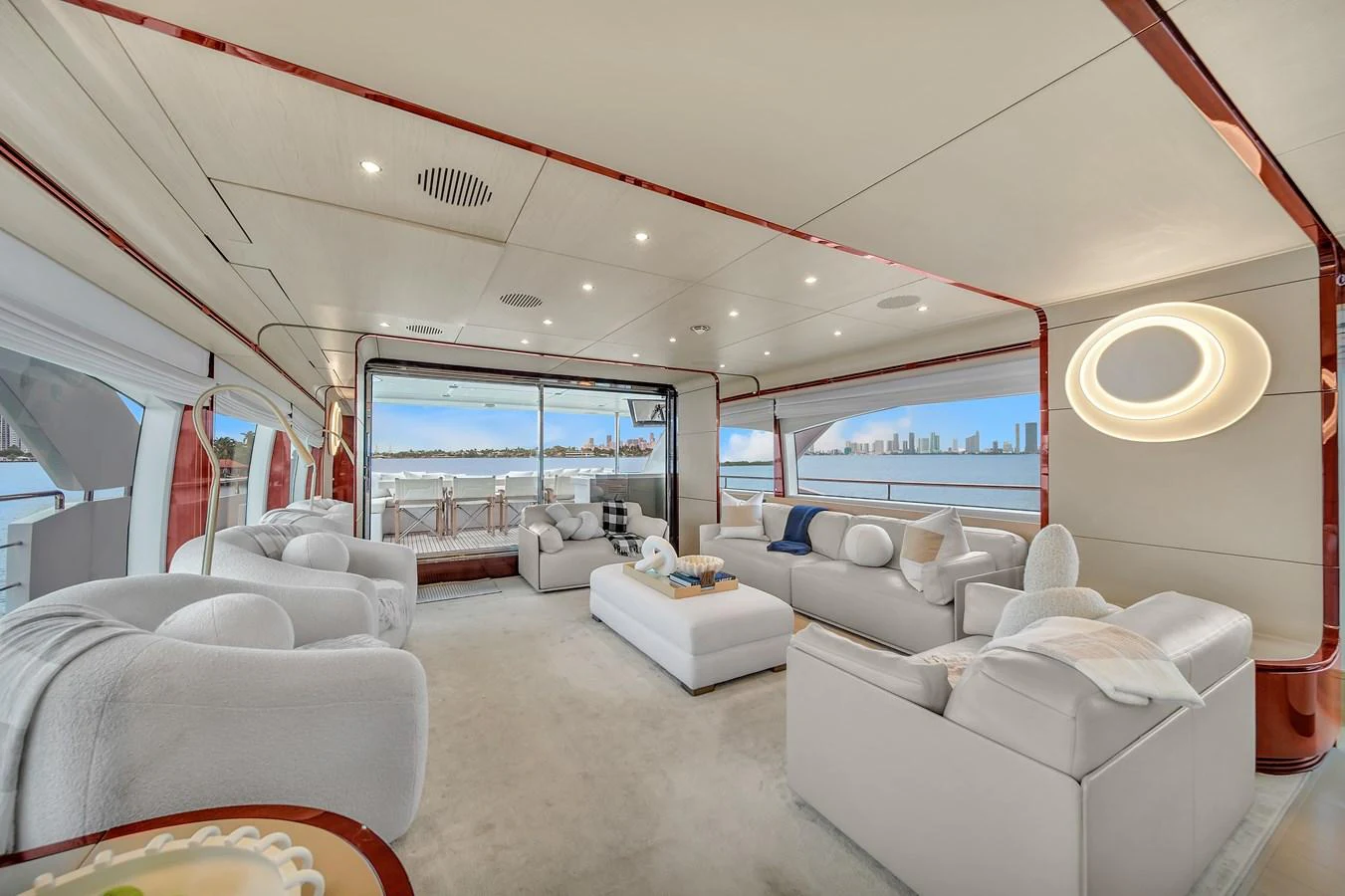 The salon features plush seating and panoramic windows offering stunning views. aboard 2017 AZIMUT 30 METRI Yacht for Sale