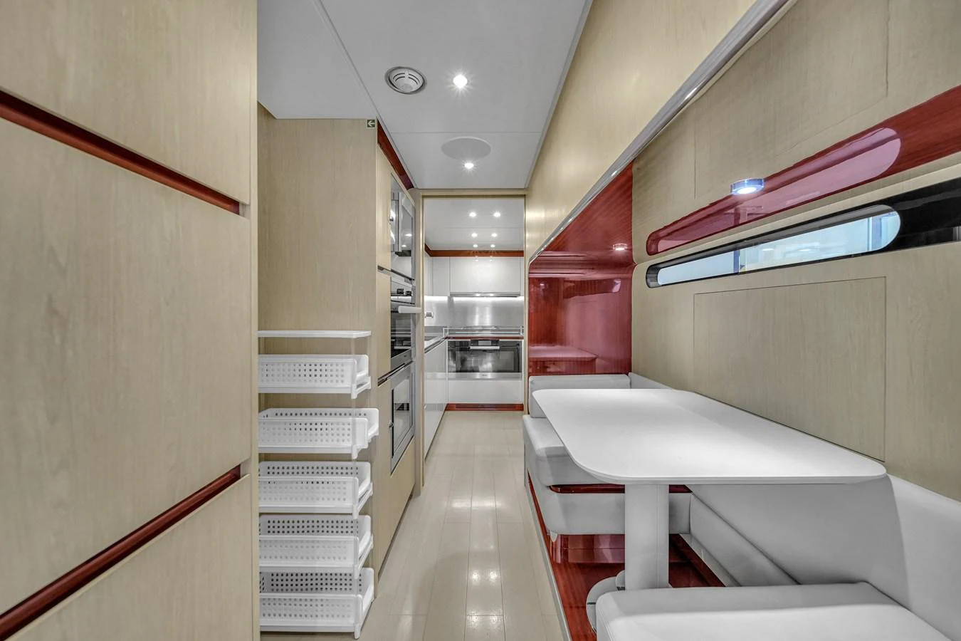 The sleek galley features modern appliances and a cozy dining area. aboard 2017 AZIMUT 30 METRI Yacht for Sale