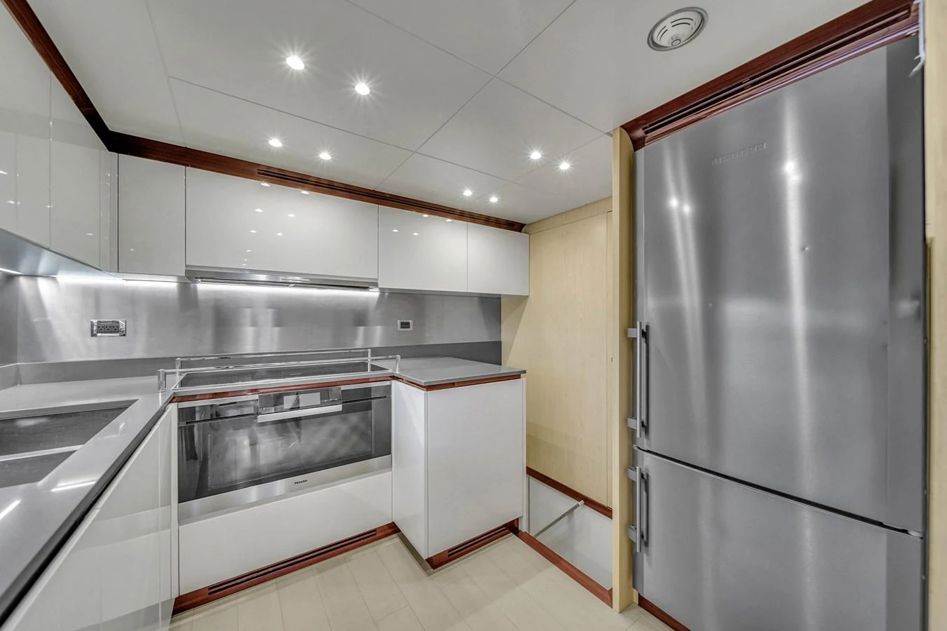 The yacht's galley features modern appliances and sleek cabinetry, creating a stylish and functional space for meal preparation. aboard 2017 AZIMUT 30 METRI Yacht for Sale