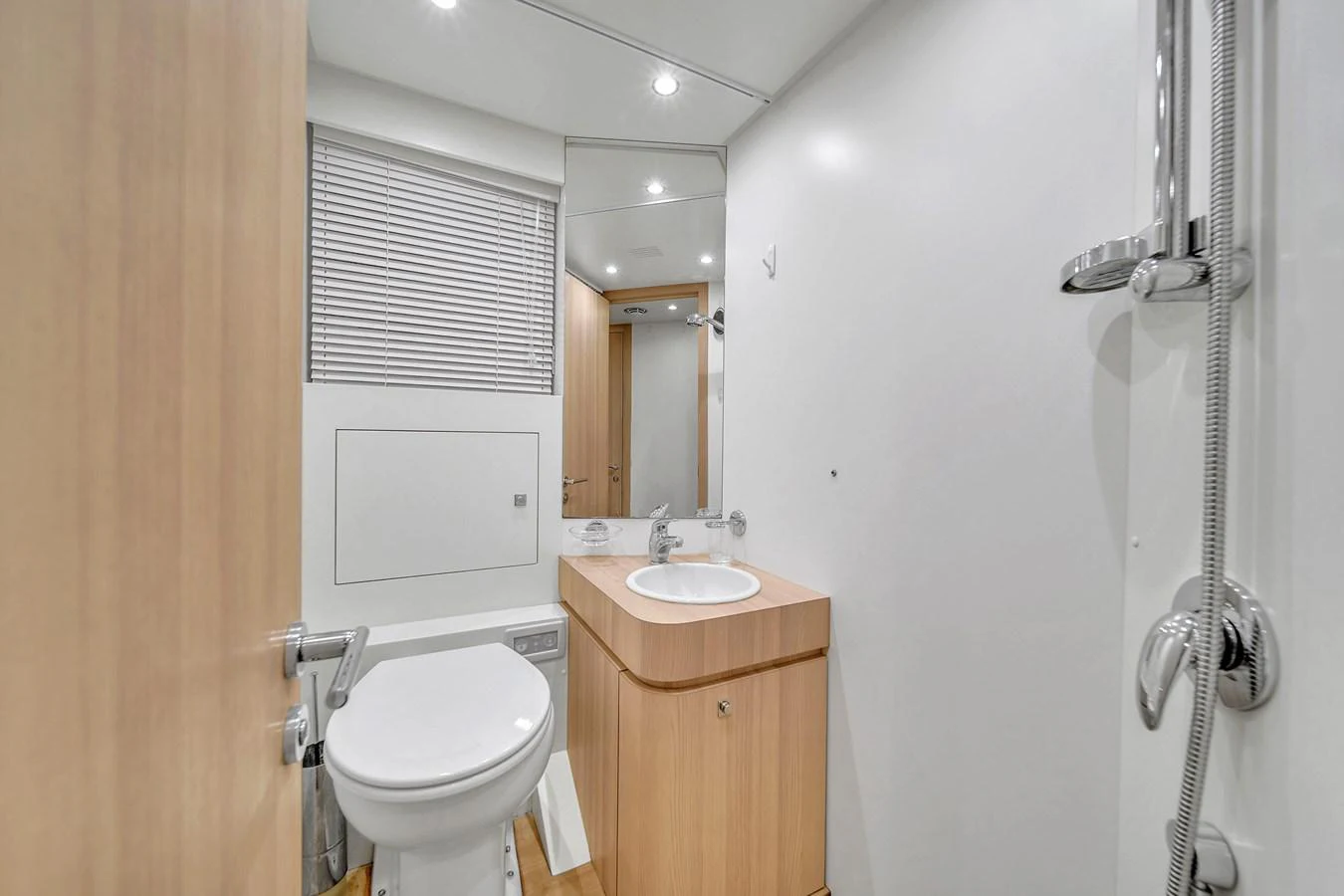 A modern yacht bathroom with sleek fixtures and a minimalist design. aboard 2017 AZIMUT 30 METRI Yacht for Sale