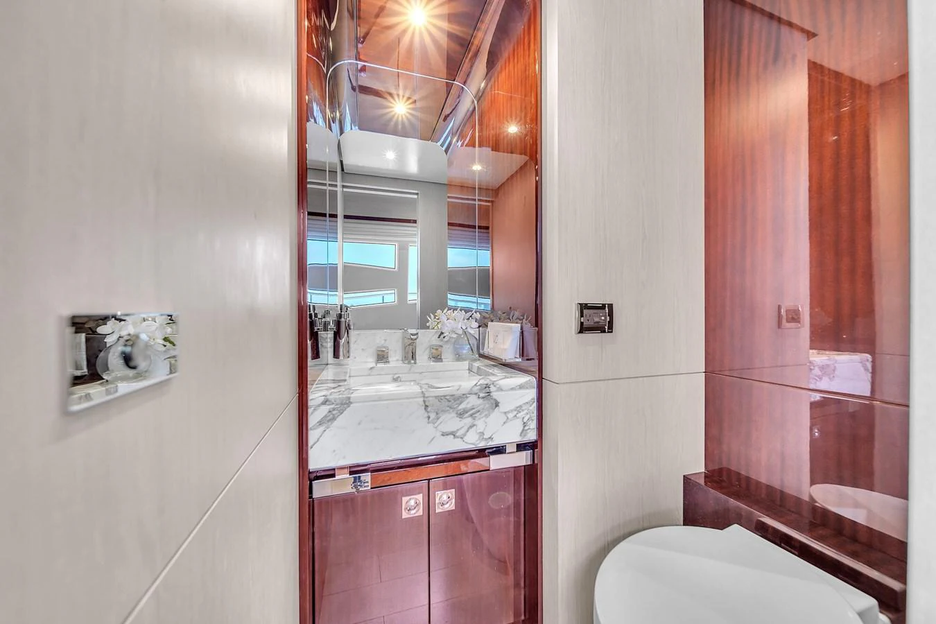 A luxurious yacht bathroom featuring a marble countertop and modern fixtures. aboard 2017 AZIMUT 30 METRI Yacht for Sale