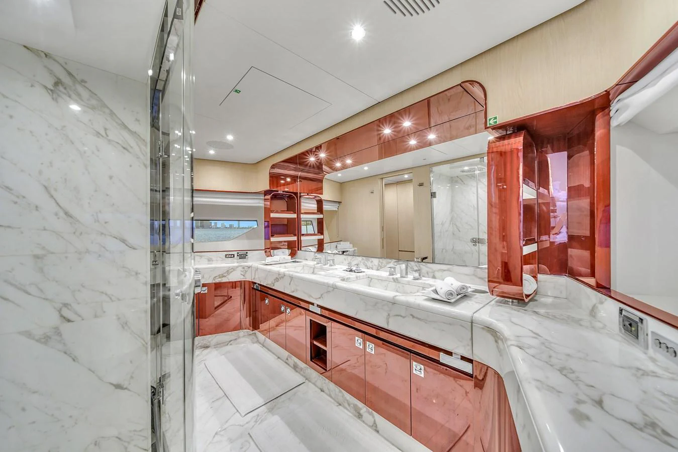 This luxurious yacht bathroom features elegant marble surfaces and modern fixtures. aboard 2017 AZIMUT 30 METRI Yacht for Sale
