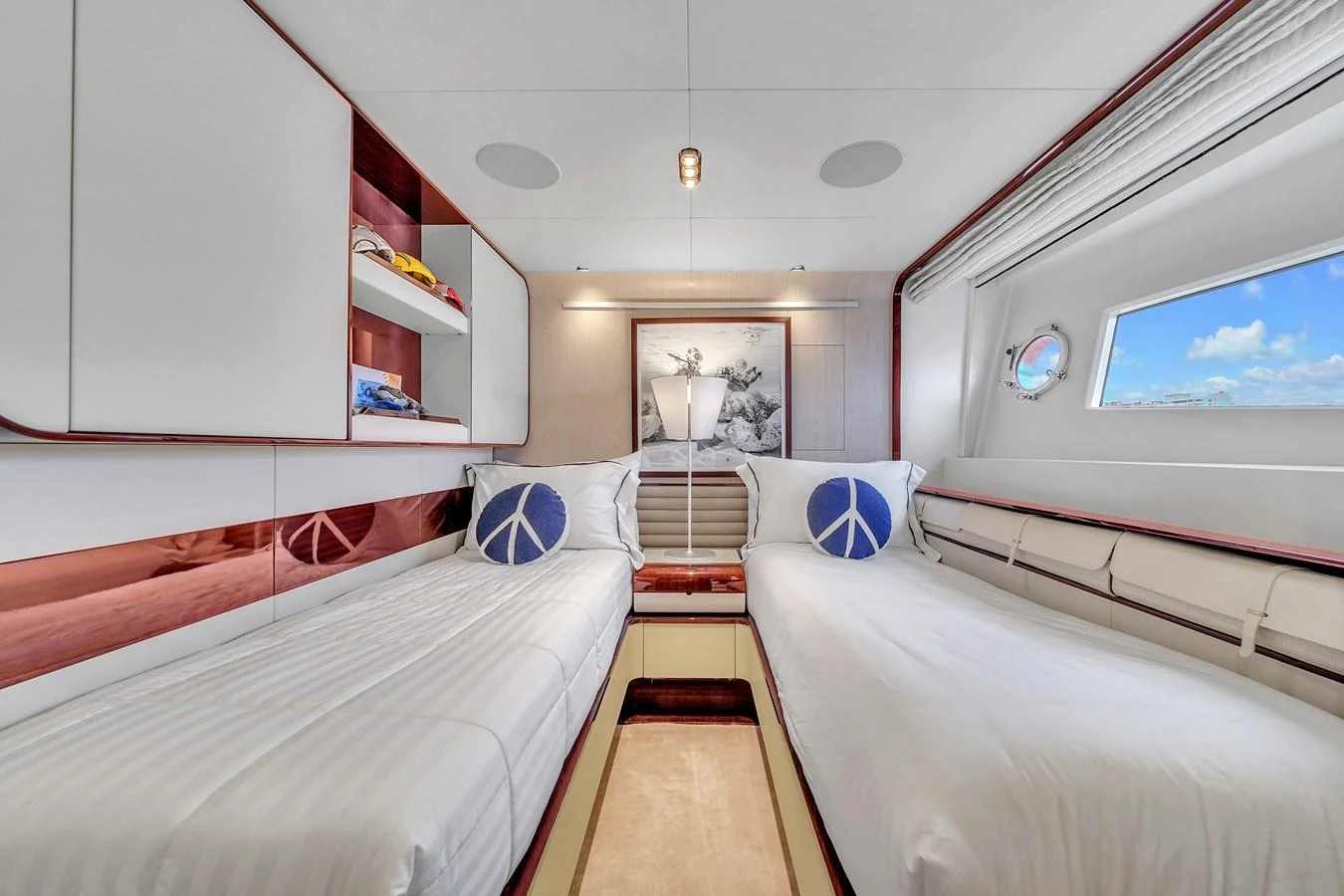 The guest stateroom features twin beds with a modern and bright design, offering a comfortable and inviting atmosphere. aboard 2017 AZIMUT 30 METRI Yacht for Sale