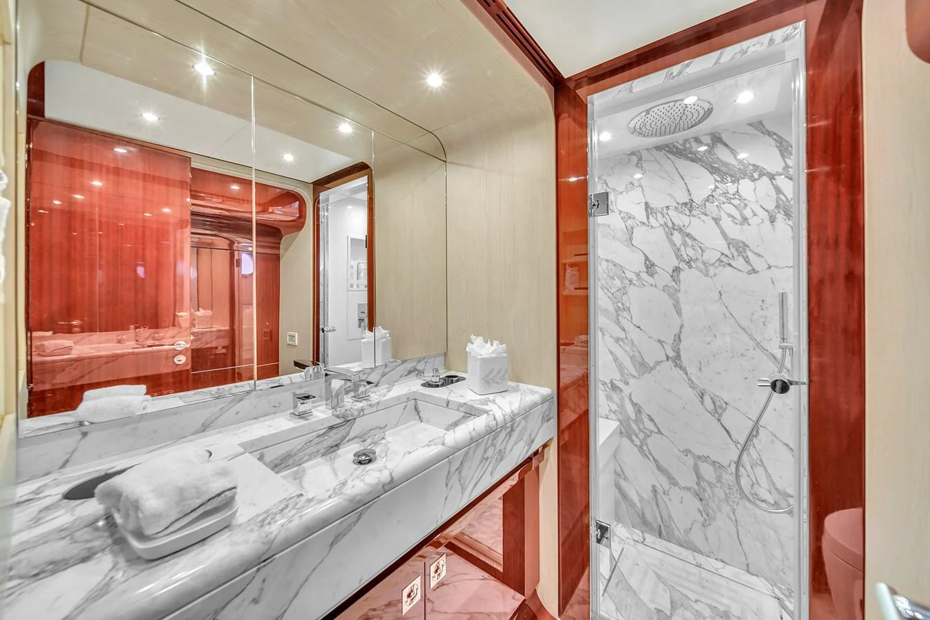 The yacht's bathroom features luxurious marble finishes and elegant wood accents. aboard 2017 AZIMUT 30 METRI Yacht for Sale