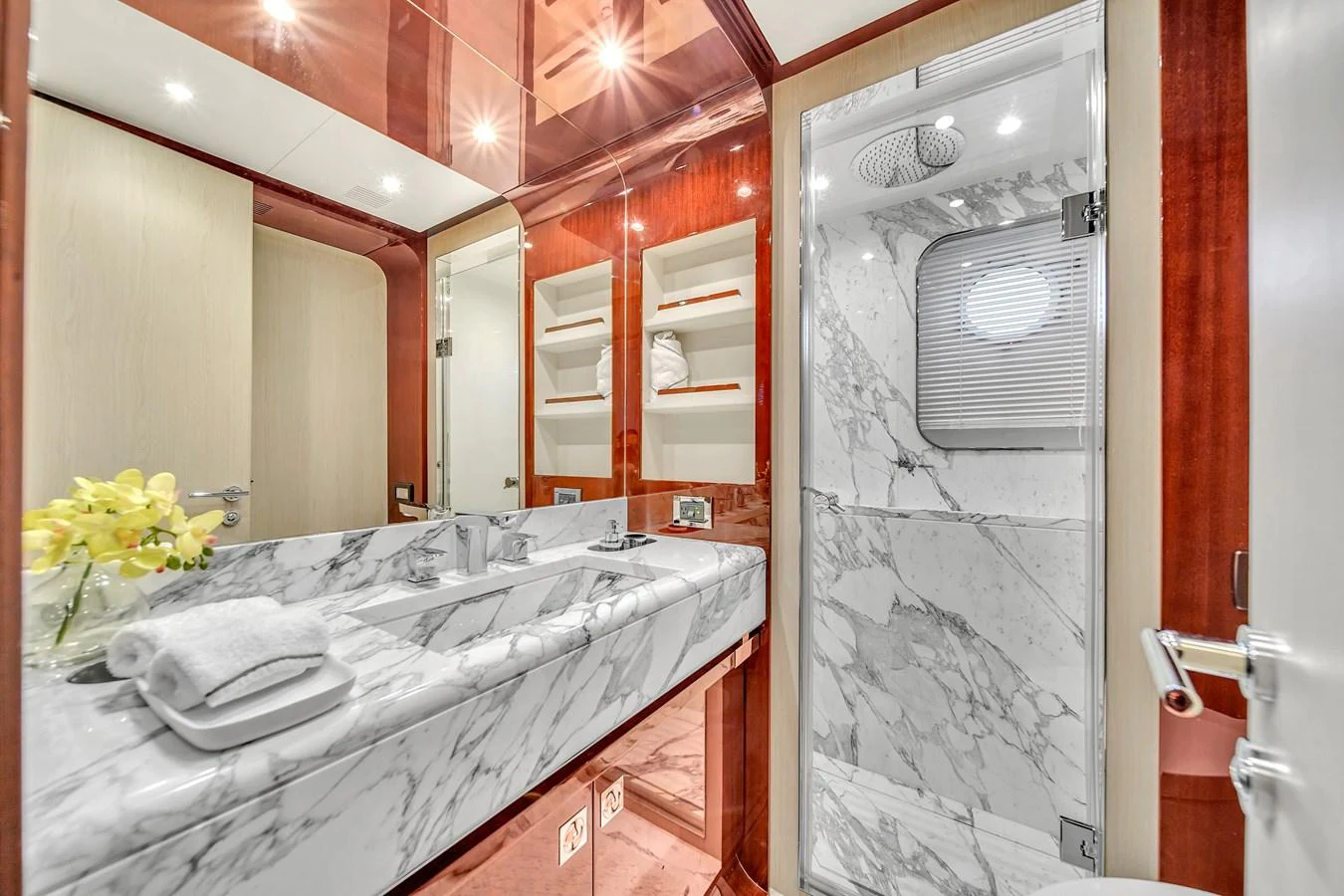 The yacht's bathroom features luxurious marble surfaces and elegant wood accents. aboard 2017 AZIMUT 30 METRI Yacht for Sale