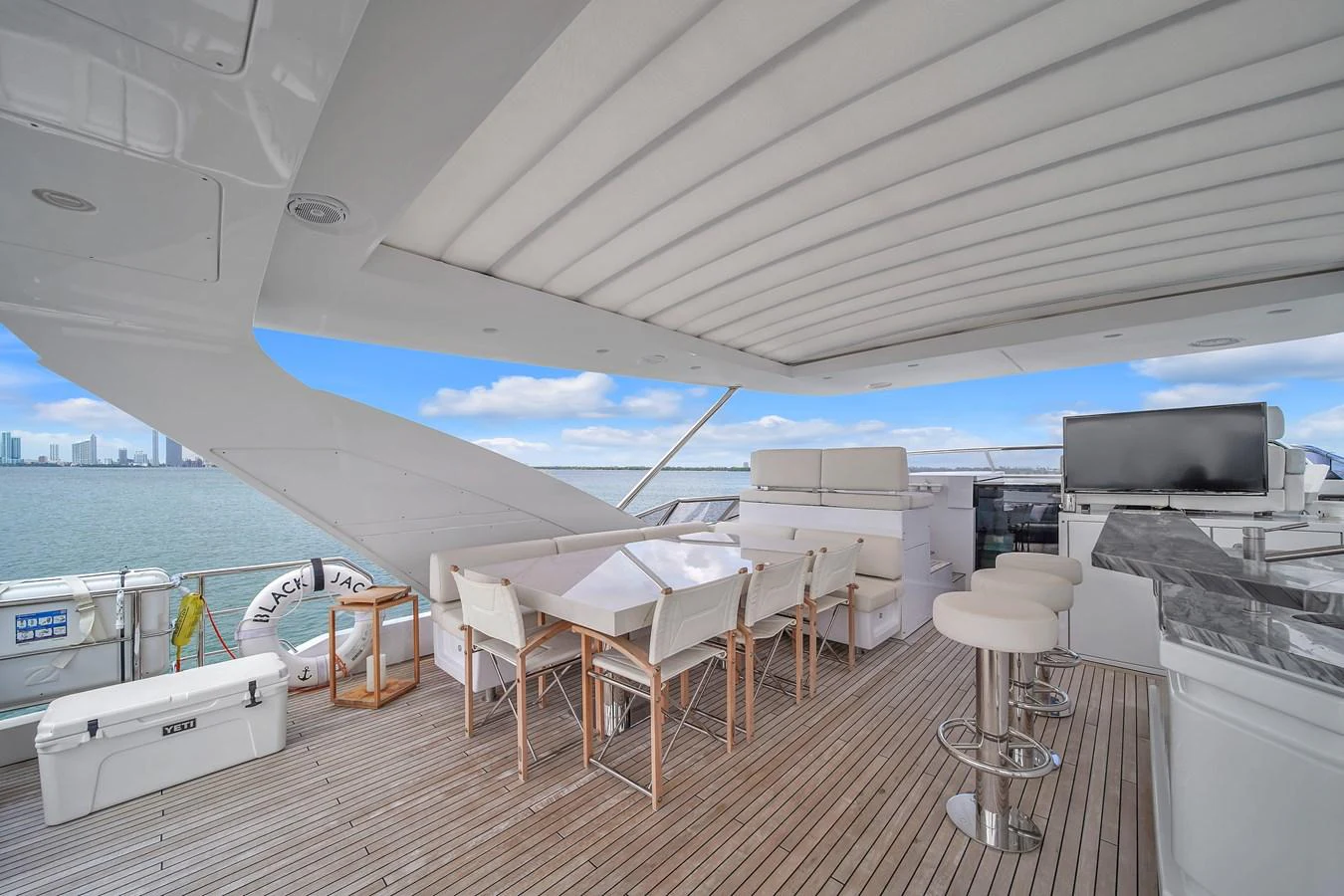 The flybridge offers a spacious and elegant outdoor dining and lounging area with stunning sea views. aboard 2017 AZIMUT 30 METRI Yacht for Sale