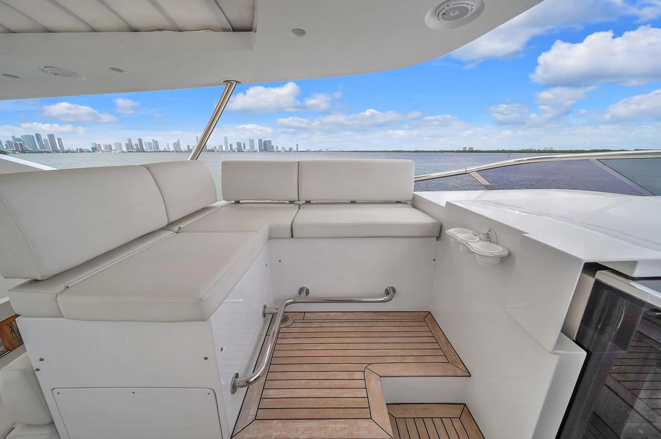 The flybridge offers a comfortable seating area with stunning views of the city skyline. aboard 2017 AZIMUT 30 METRI Yacht for Sale