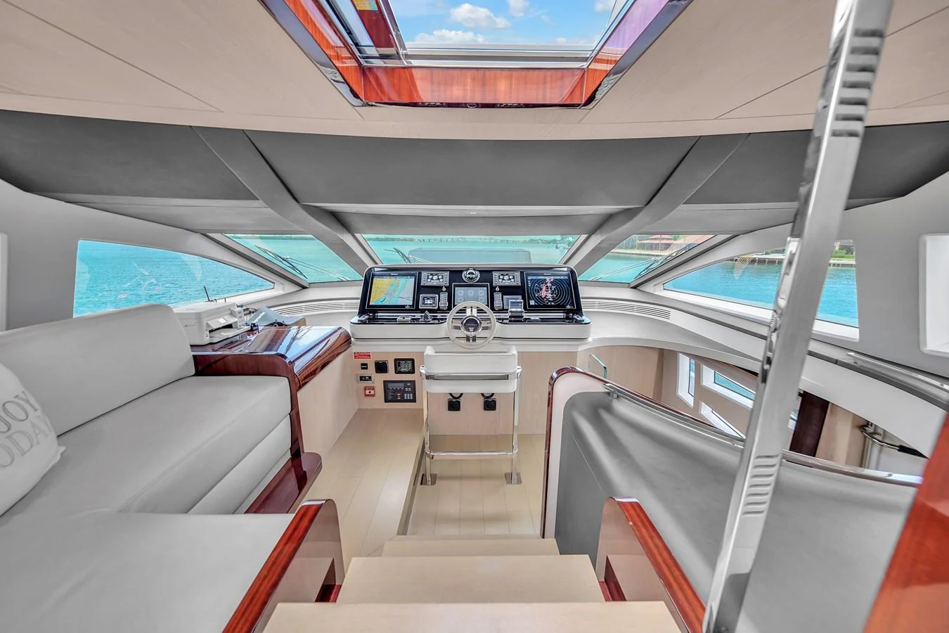 The helm station offers a panoramic view with state-of-the-art navigation equipment and luxurious seating. aboard 2017 AZIMUT 30 METRI Yacht for Sale