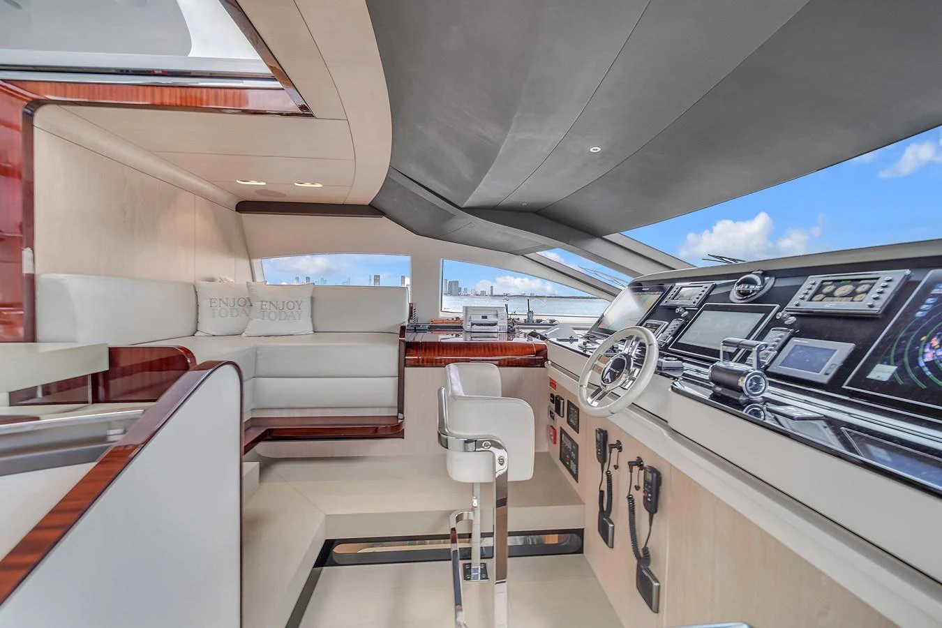 The helm station features state-of-the-art navigation equipment and luxurious seating with panoramic views. aboard 2017 AZIMUT 30 METRI Yacht for Sale