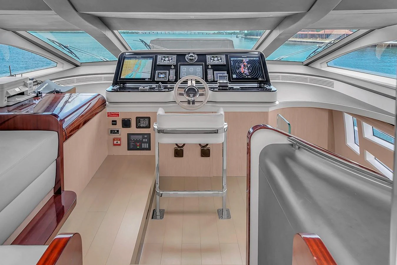 The helm station features state-of-the-art navigation equipment and a comfortable captain's chair with a panoramic view. aboard 2017 AZIMUT 30 METRI Yacht for Sale