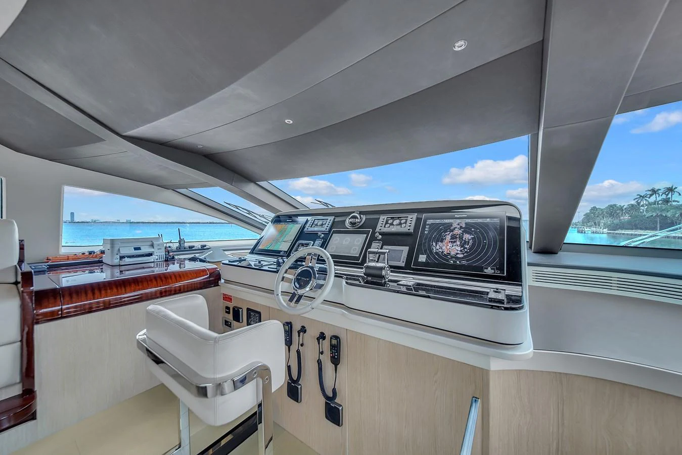 The helm station offers advanced navigation technology with panoramic views. aboard 2017 AZIMUT 30 METRI Yacht for Sale
