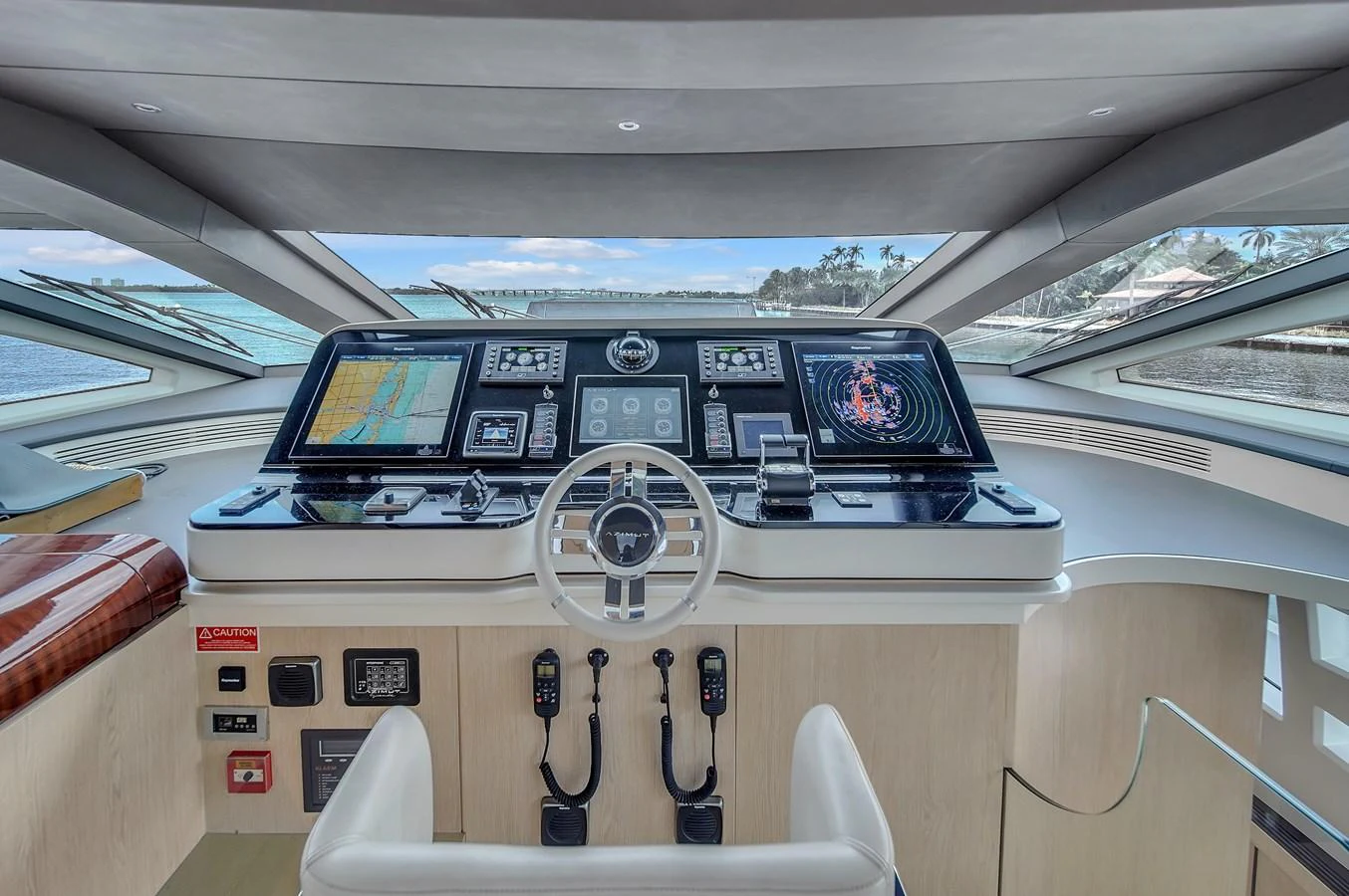 The helm station features advanced navigation equipment and a panoramic view. aboard 2017 AZIMUT 30 METRI Yacht for Sale