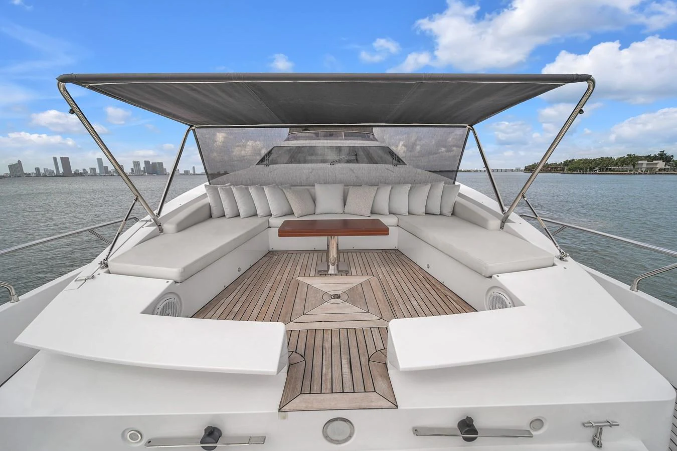 The yacht's flybridge offers a spacious seating area with a retractable sunshade, perfect for enjoying panoramic views. aboard 2017 AZIMUT 30 METRI Yacht for Sale