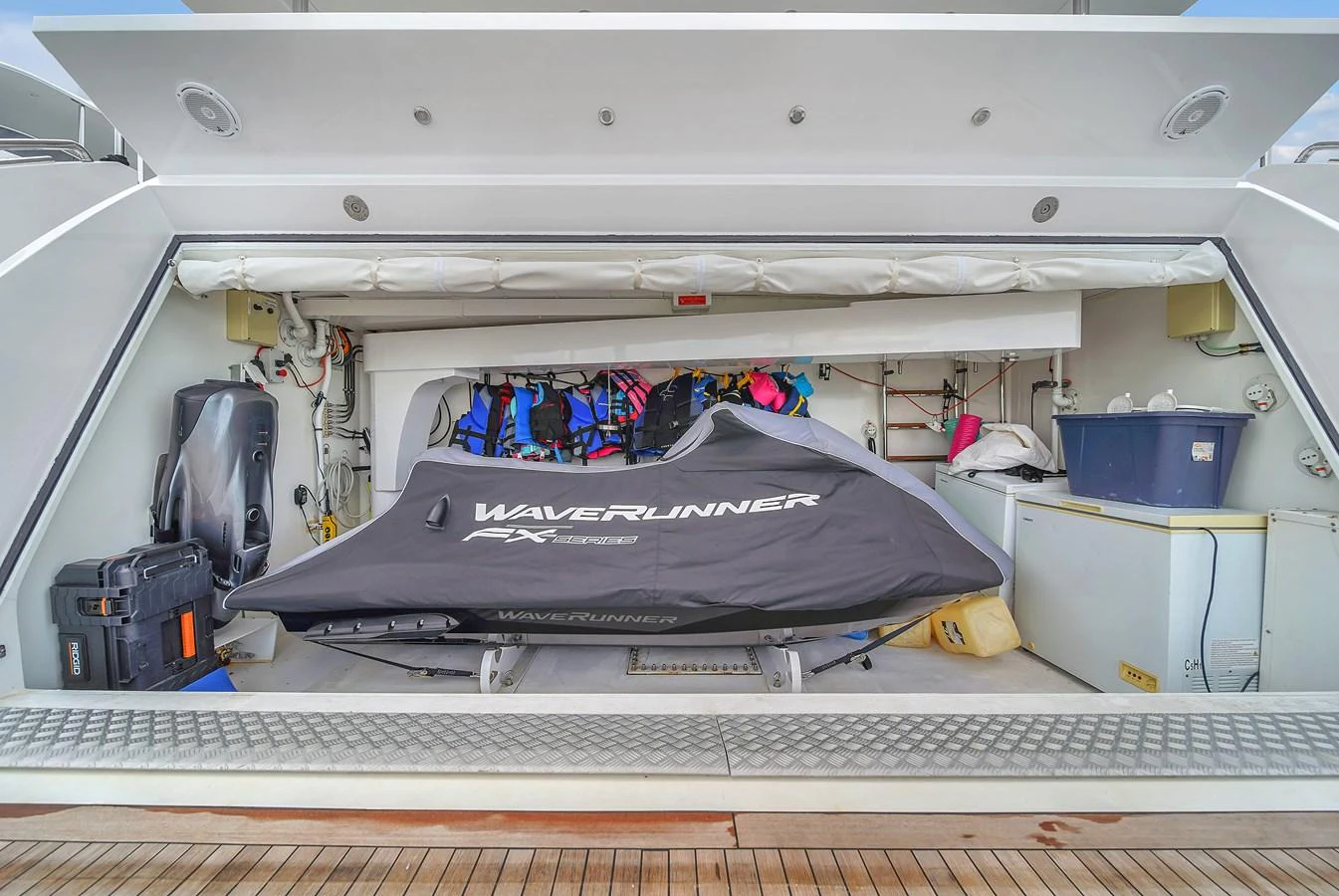 The image showcases a neatly stored Waverunner in the yacht's toy garage, ready for water adventures. aboard 2017 AZIMUT 30 METRI Yacht for Sale
