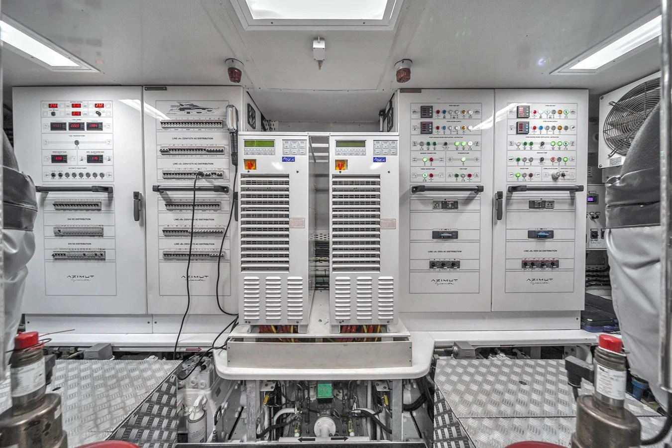 The yacht's engine room is equipped with advanced control panels and machinery, ensuring optimal performance and safety. aboard 2017 AZIMUT 30 METRI Yacht for Sale