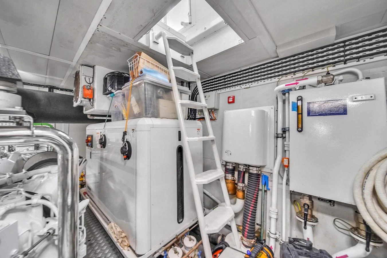 The image showcases the well-organized and clean engine room of the yacht, highlighting its technical equipment and systems. aboard 2017 AZIMUT 30 METRI Yacht for Sale