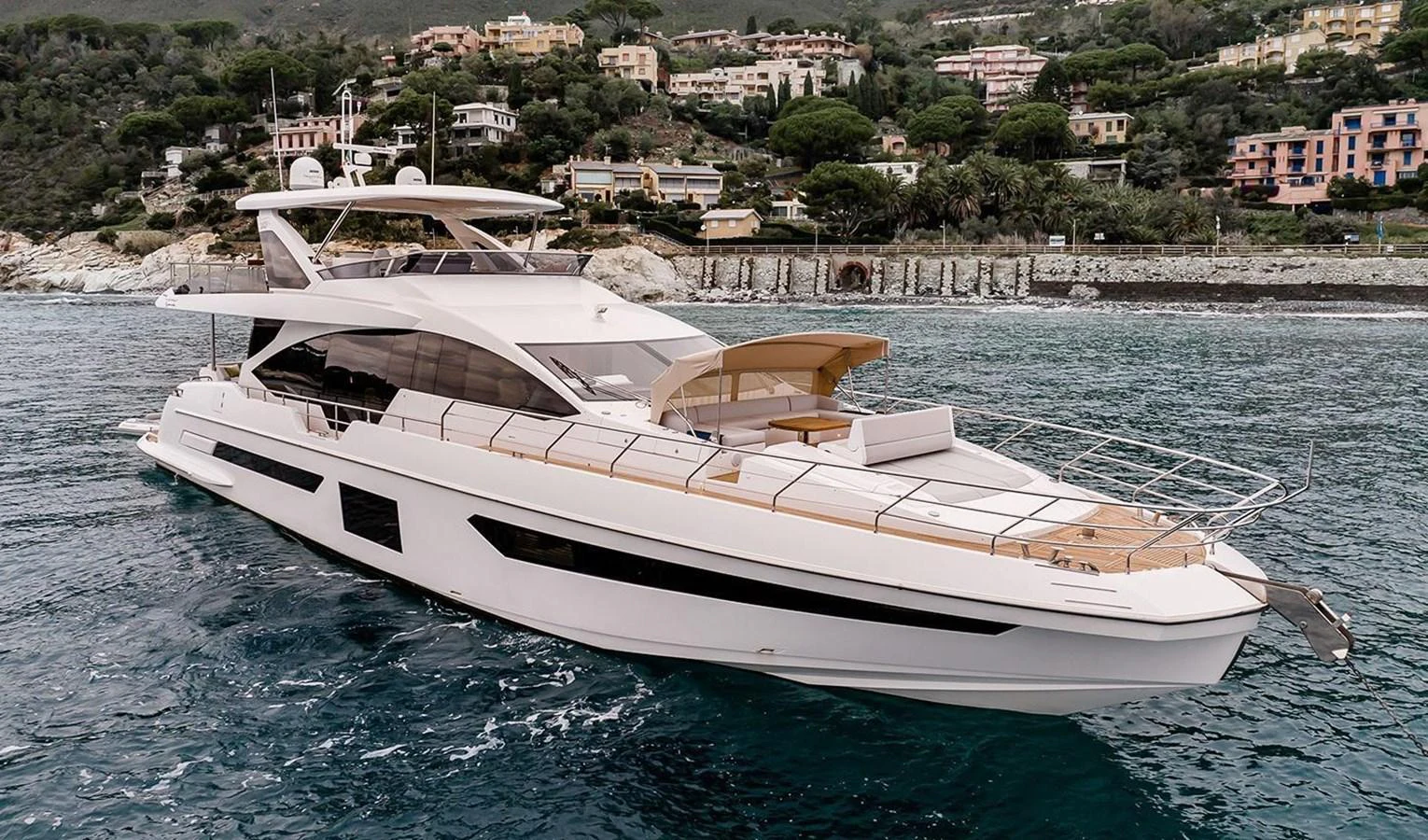 A sleek and modern yacht cruising along a picturesque coastline. aboard LASTOCHKA Yacht for Sale