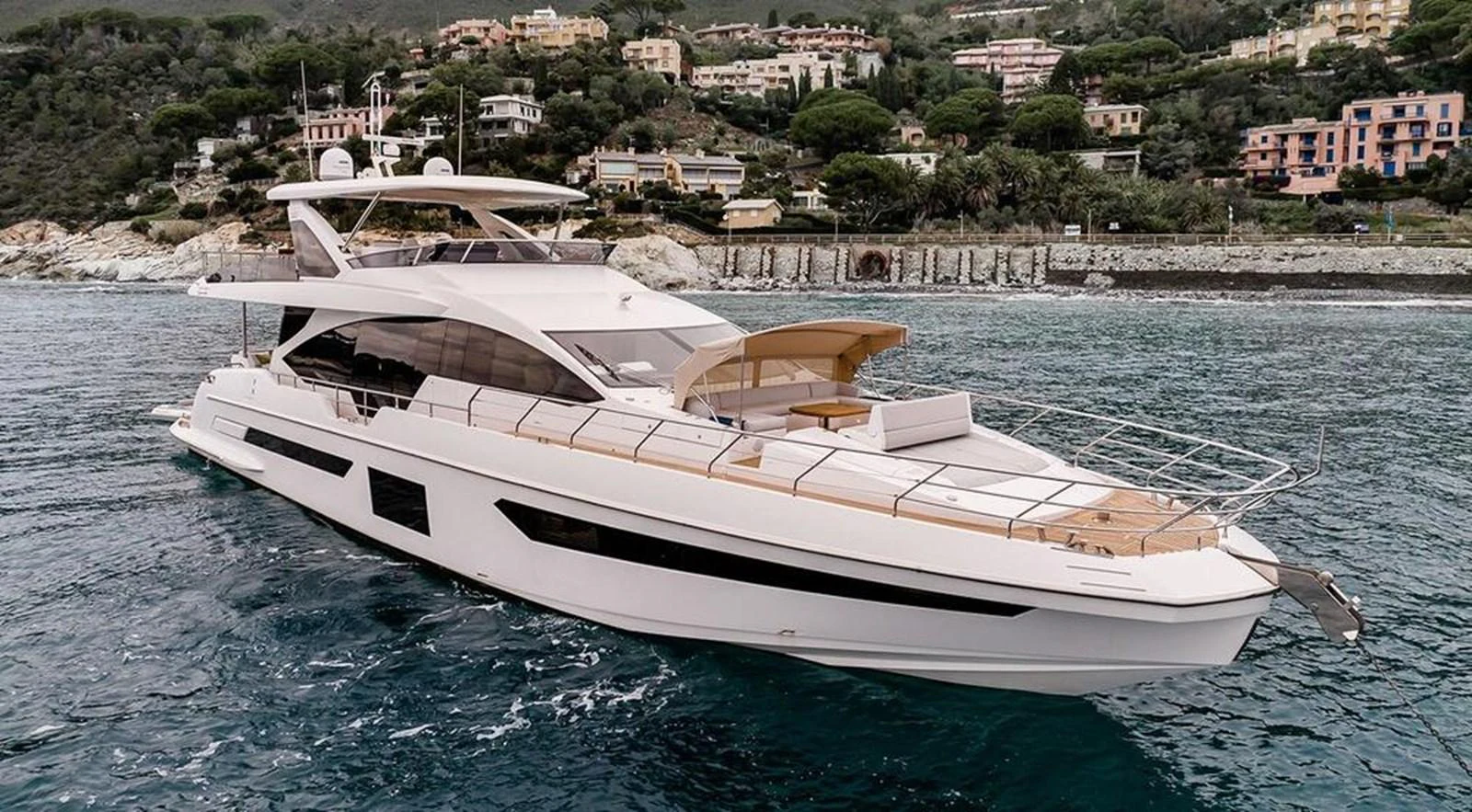 A sleek and modern yacht cruising along a picturesque coastline. aboard LASTOCHKA Yacht for Sale