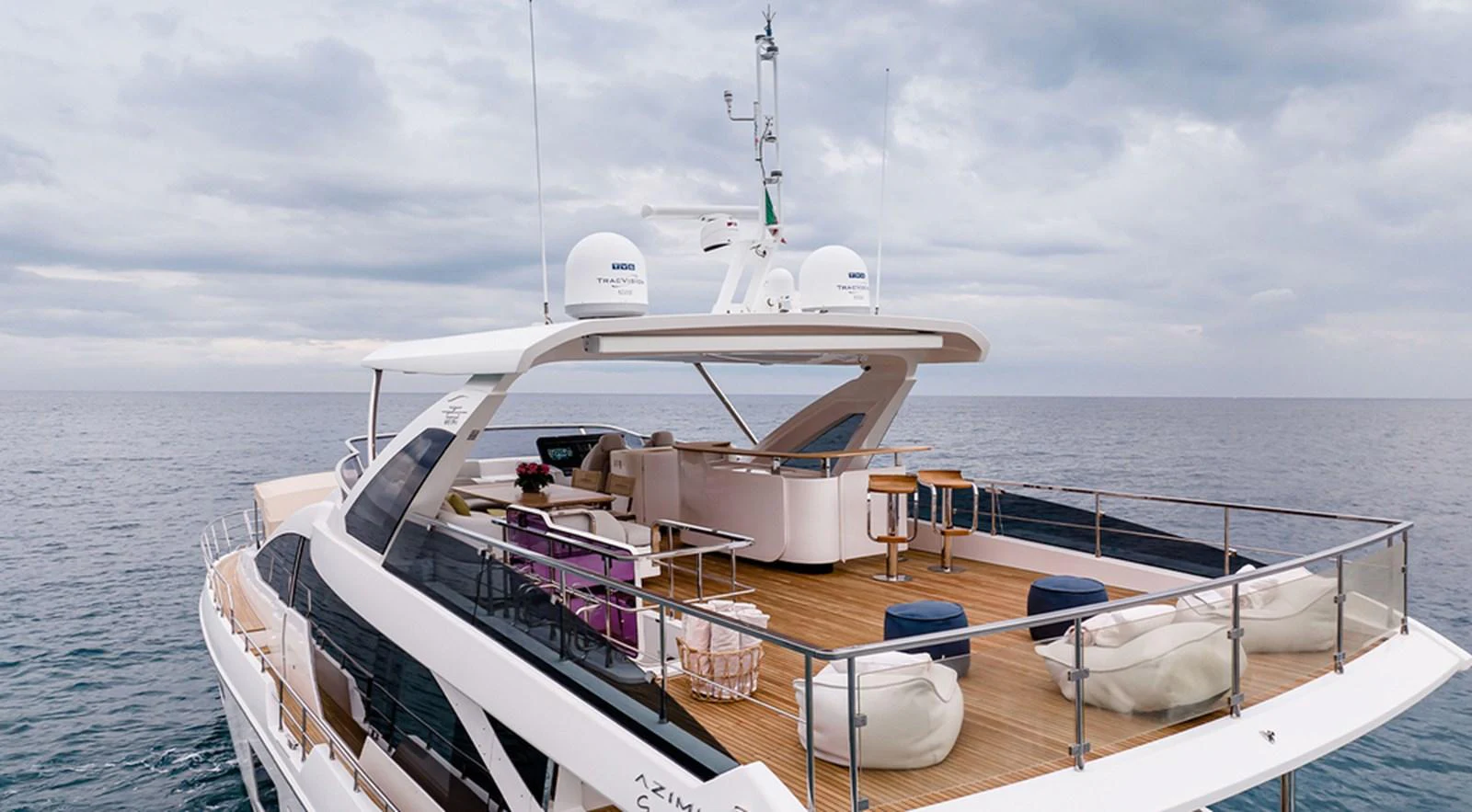 The yacht's flybridge offers a spacious and luxurious outdoor area with ample seating and lounging options. aboard LASTOCHKA Yacht for Sale