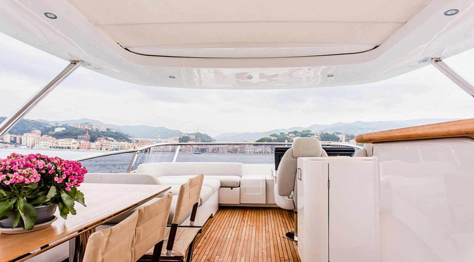 The flybridge offers a spacious and elegant area with comfortable seating and stunning views. aboard LASTOCHKA Yacht for Sale