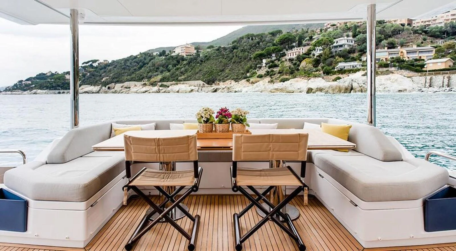 The aft deck offers a comfortable dining area with scenic views of the coastline. aboard LASTOCHKA Yacht for Sale