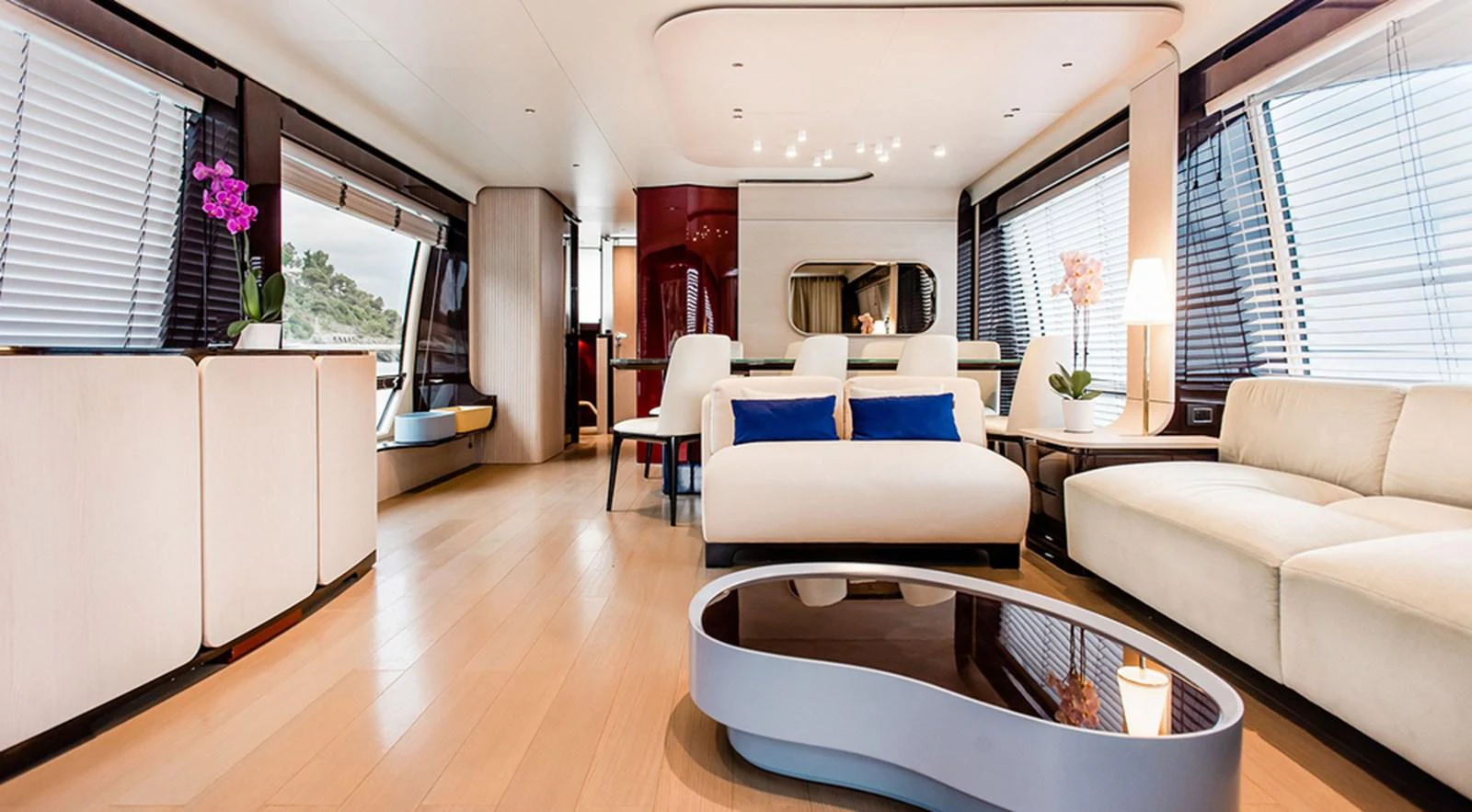 The salon features a spacious and elegantly designed seating area with modern furnishings and ample natural light. aboard LASTOCHKA Yacht for Sale
