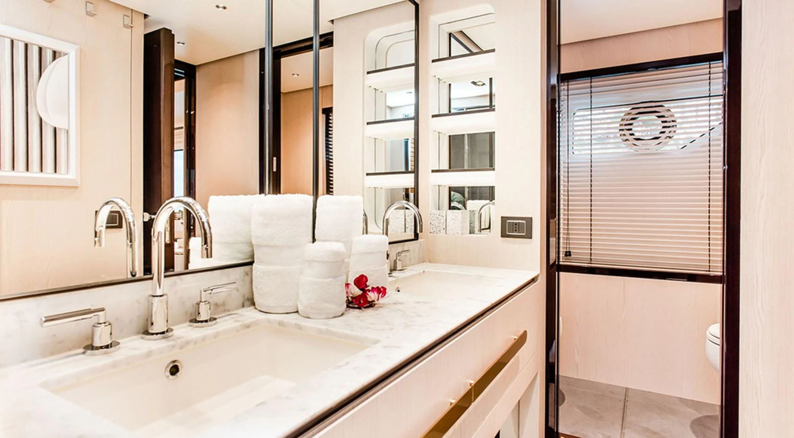 The yacht's bathroom features a sleek design with modern fixtures and luxurious amenities. aboard LASTOCHKA Yacht for Sale