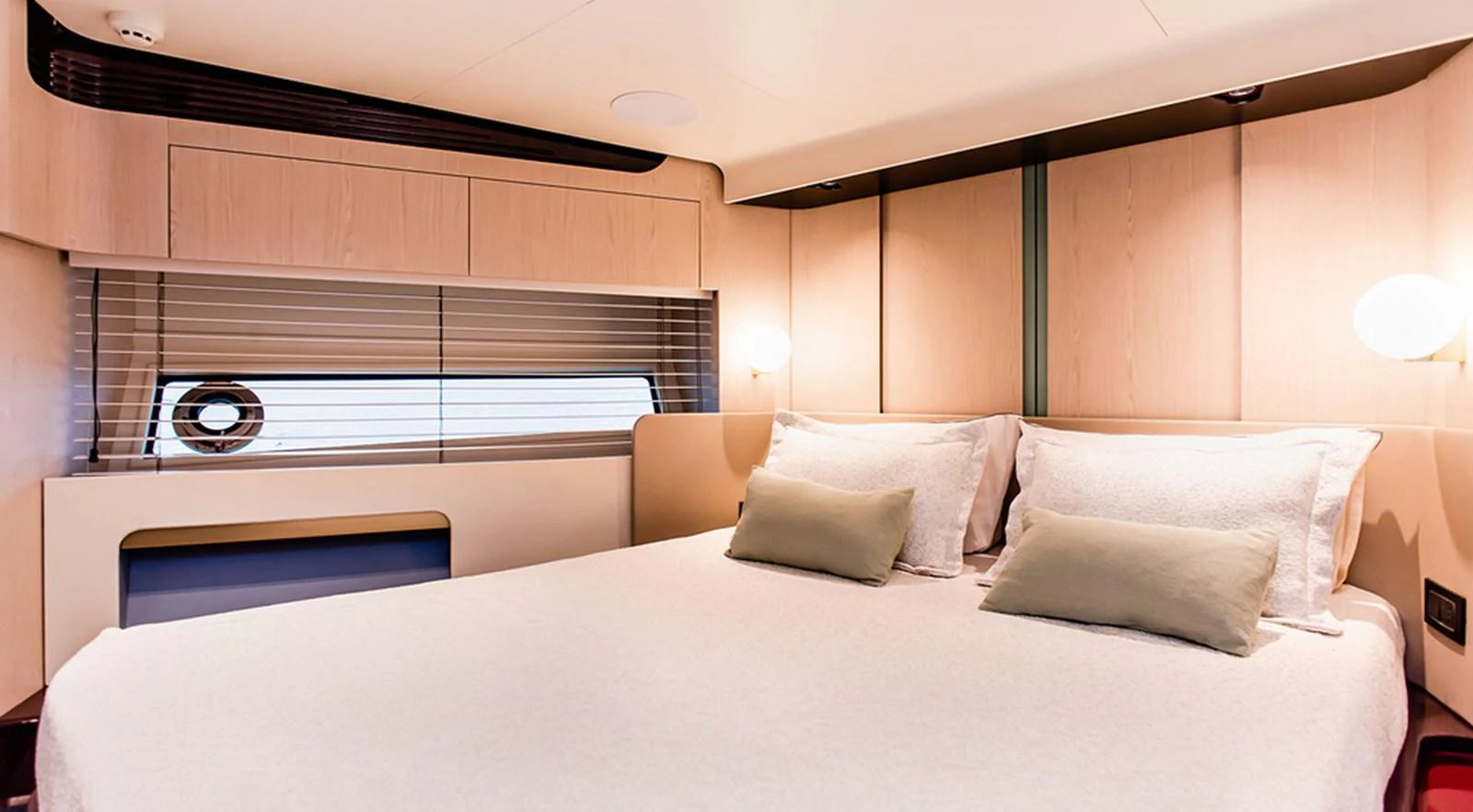 The stateroom features a plush bed with elegant bedding and soft lighting, creating a serene and inviting atmosphere. aboard LASTOCHKA Yacht for Sale