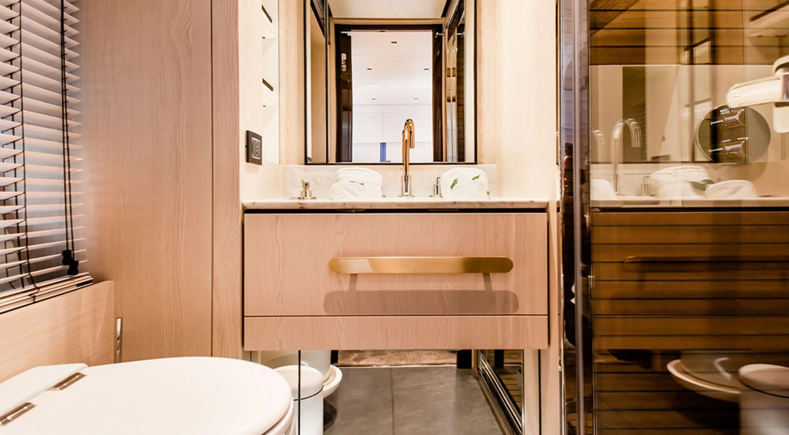The yacht's bathroom features a modern design with sleek fixtures and ample lighting. aboard LASTOCHKA Yacht for Sale